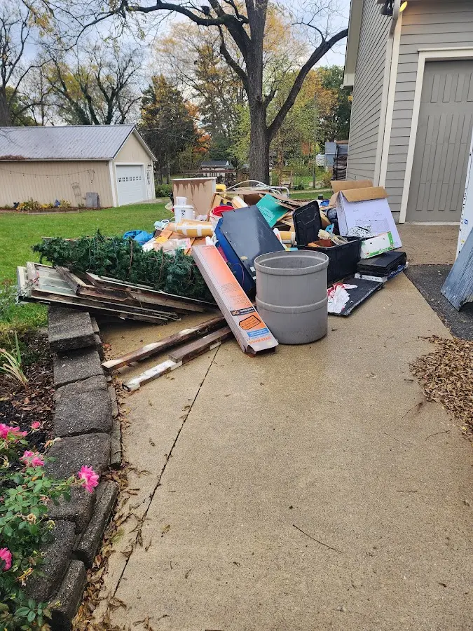 Dumpster being loaded with debris for Demolition Dumpster Rental in Dilworth